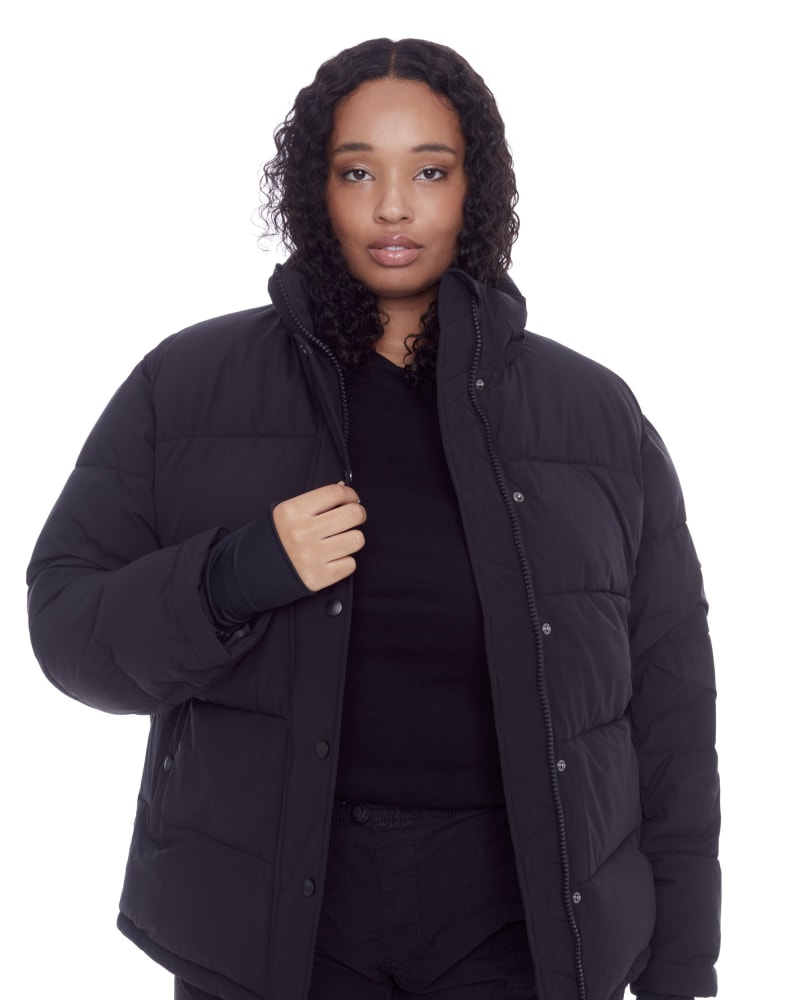 Front of a model wearing a size 2X Women's Plus Size - FORILLON | Vegan Down Recycled Short Quilted Puffer Jacket in Black by Alpine North. | dia_product_style_image_id:320672